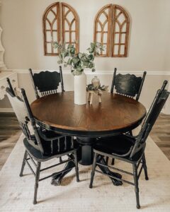 A Black and Wood Table With Black Wooden Dining Chairs