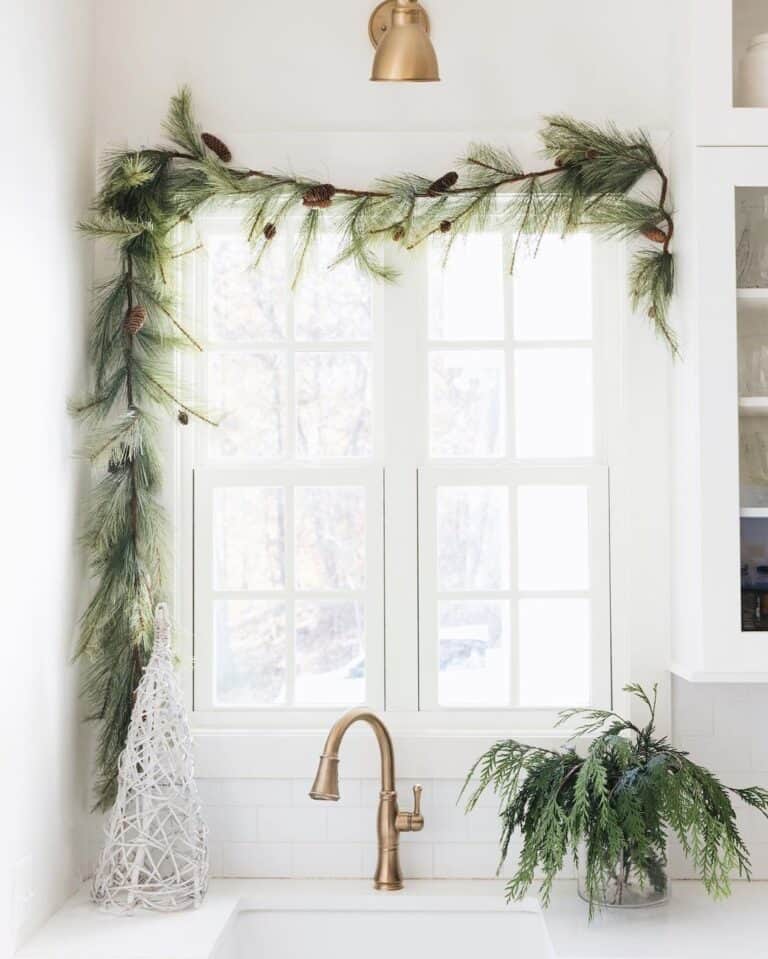 A Brass Kitchen Faucet On a White Counter