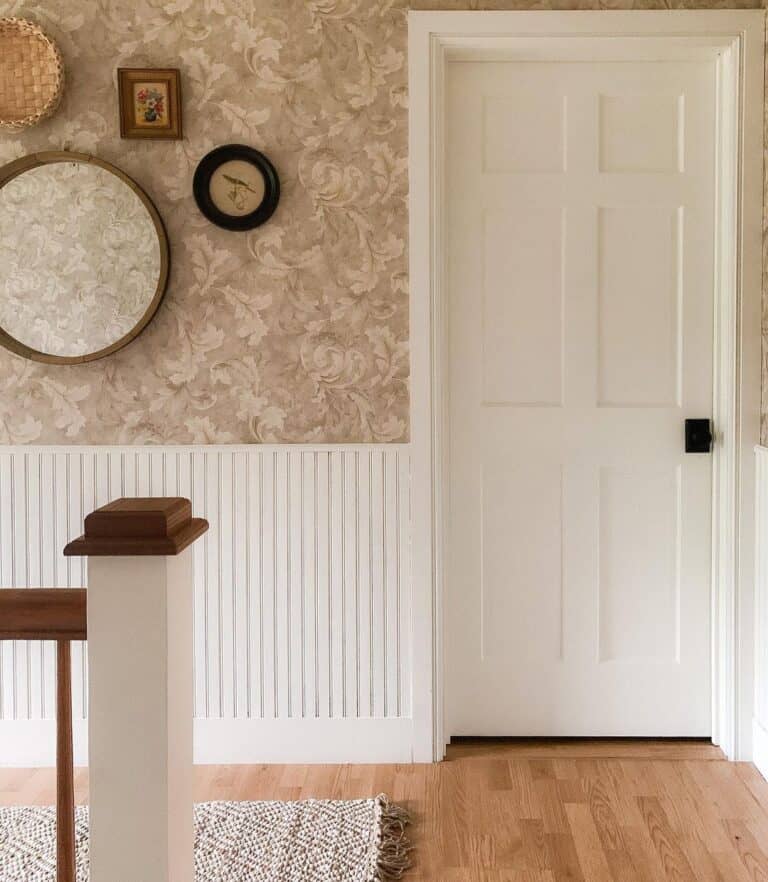 A White Interior Door with White Wainscoting