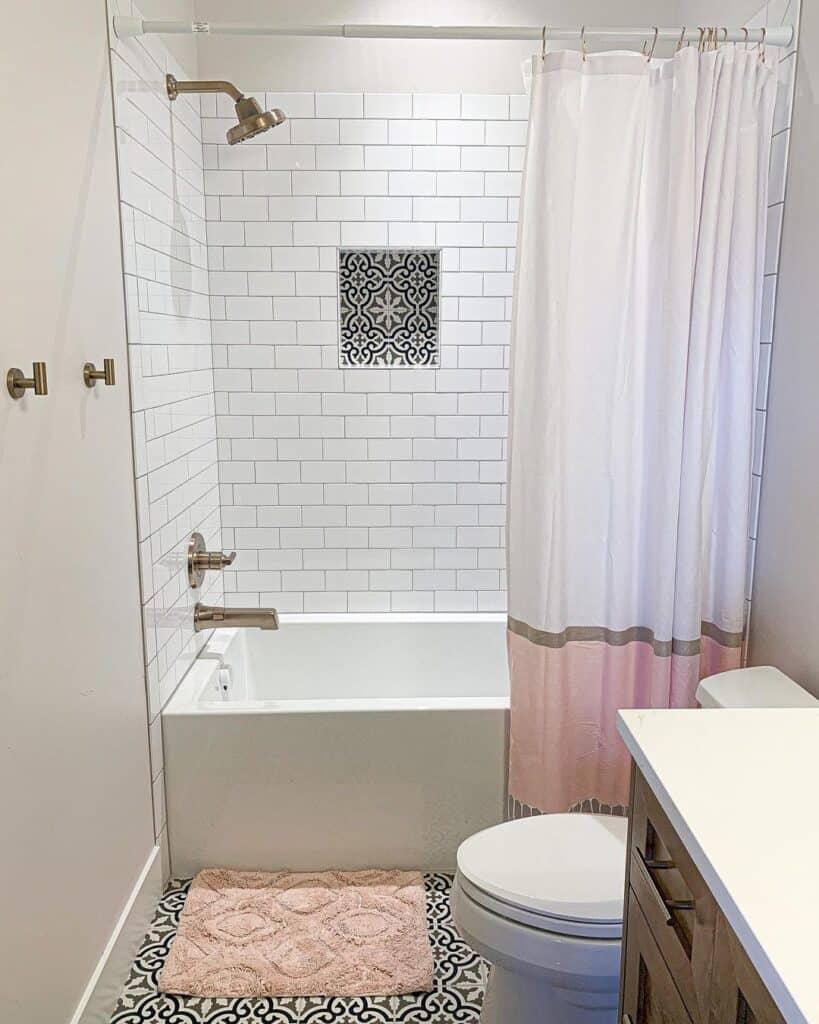 Alcove Bathtub Paired with Pink Accessories