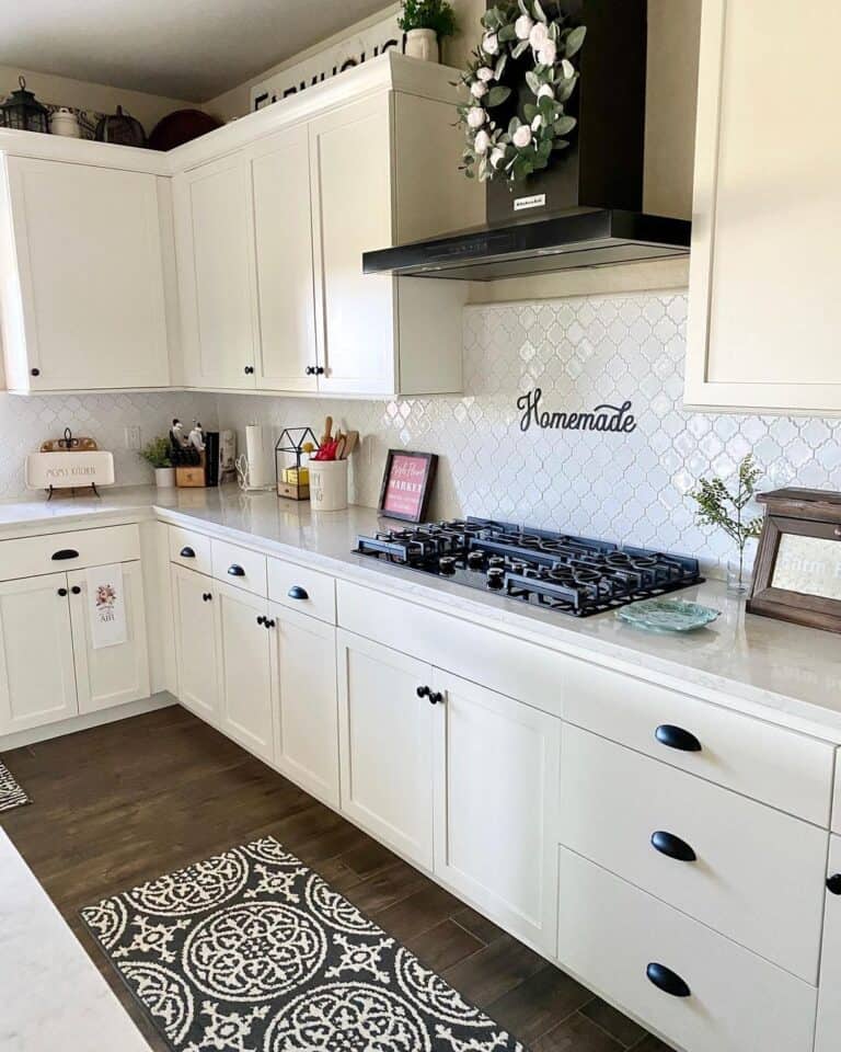 All White Kitchen with Matte Black Cup Drawer Pulls and Knobs