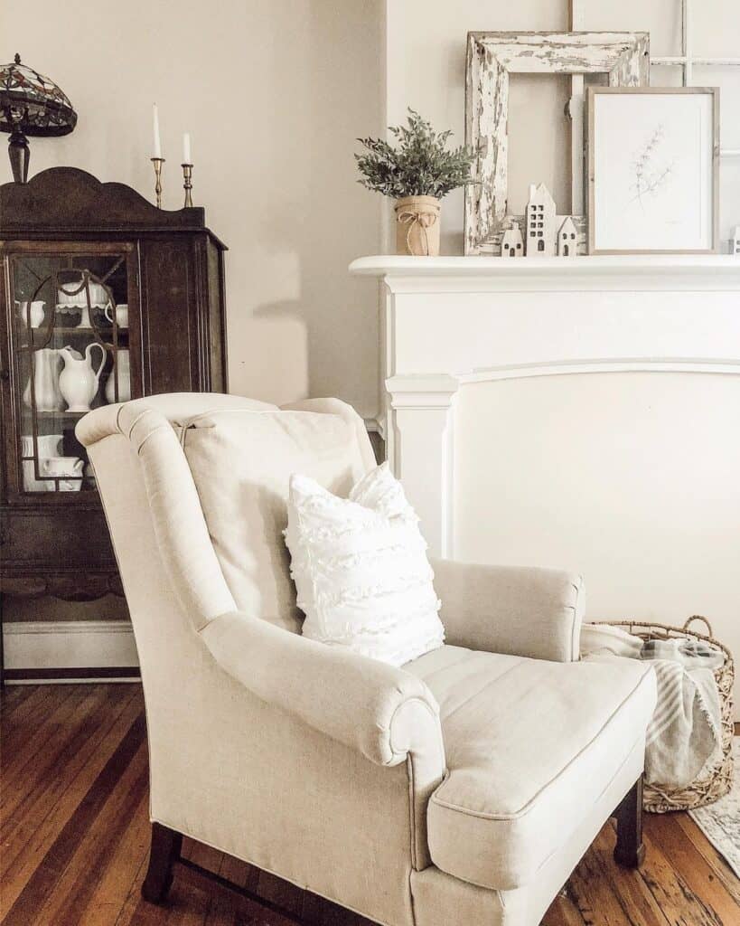 Antique Black Cabinet Next to White Mantel