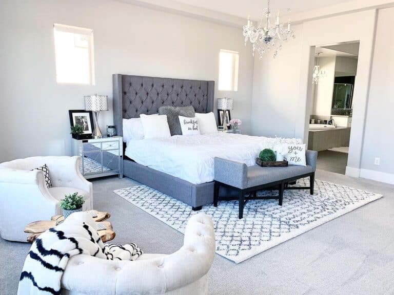 Bedroom with Gray Headboard and Sitting Area