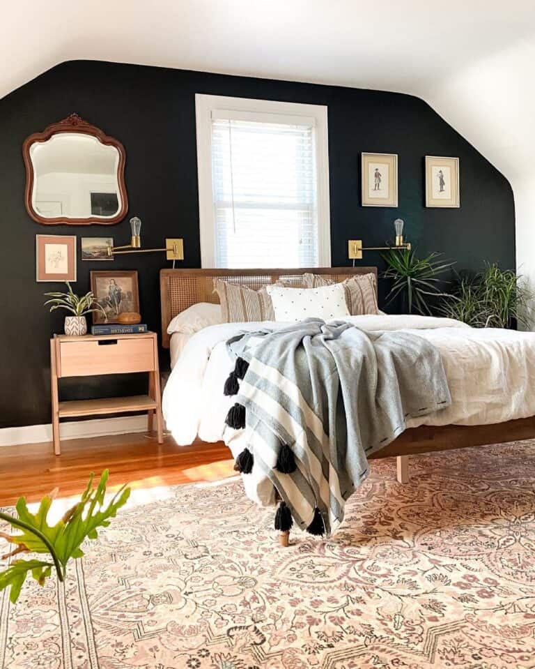 Beige Area Rug Under Bed Pushed Against a Black Wall