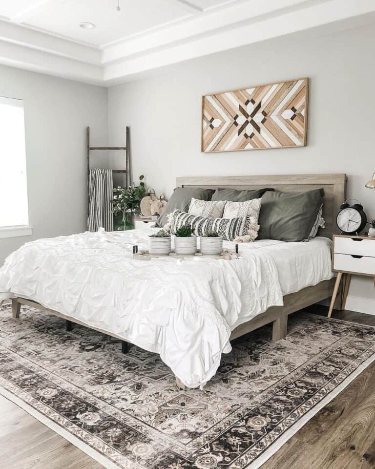 Beige Area Rug Under a Bed With White Bedding