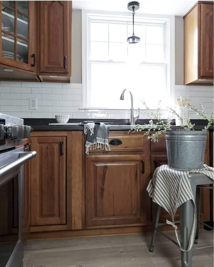 Black Countertop and Wood Cabinet Kitchen