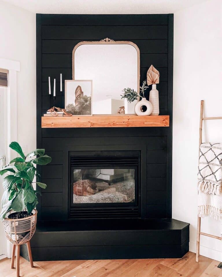 Black Fireplace Wall with Wood Mantel