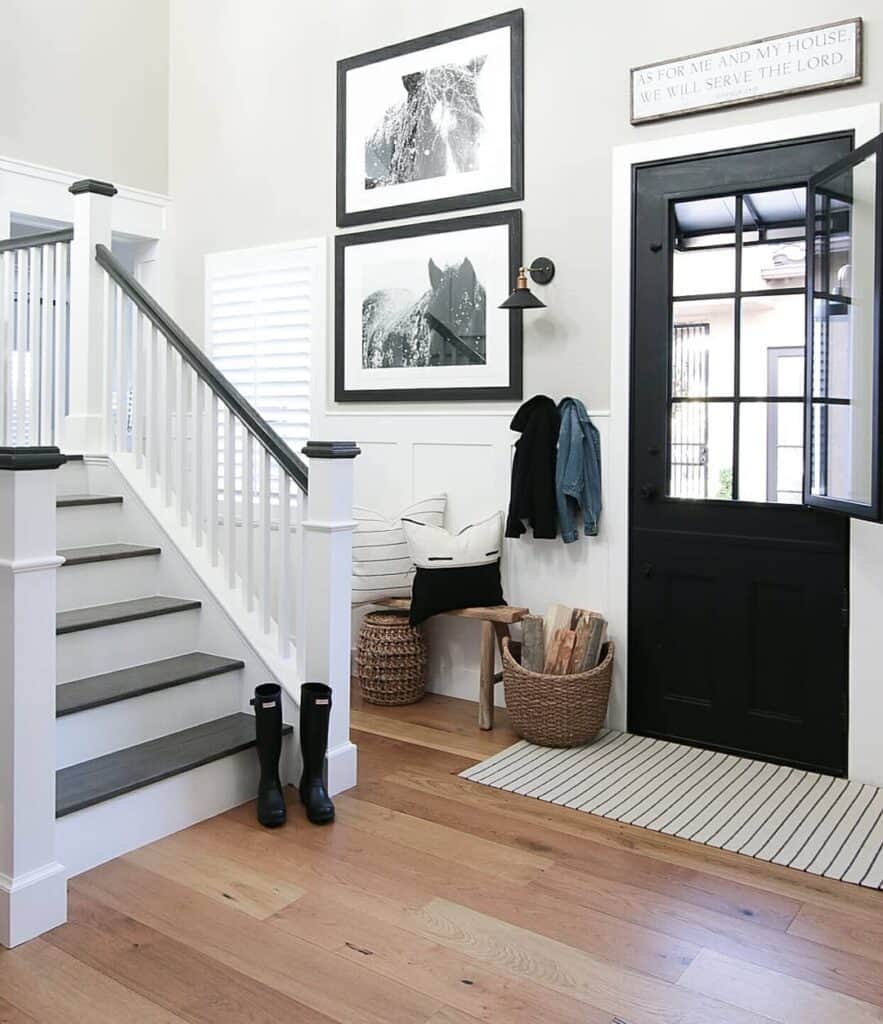 Black Front Door with Black and White Staircase