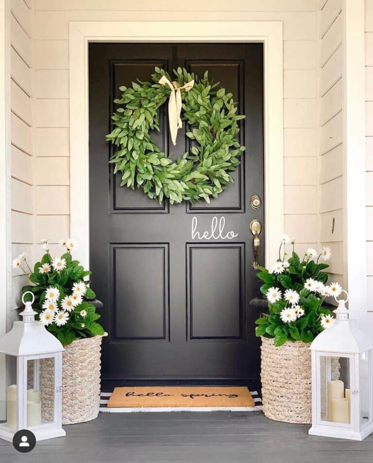 Black Front Door with Large Green Wreath