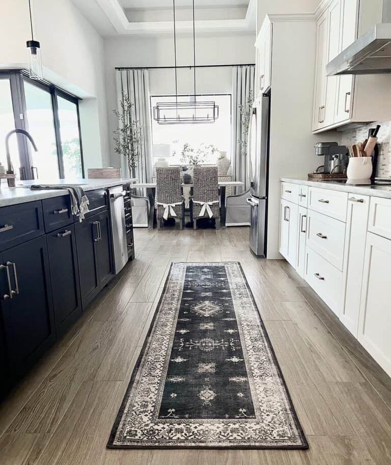 Black Kitchen Runner Rug Between Black and White Cabinets