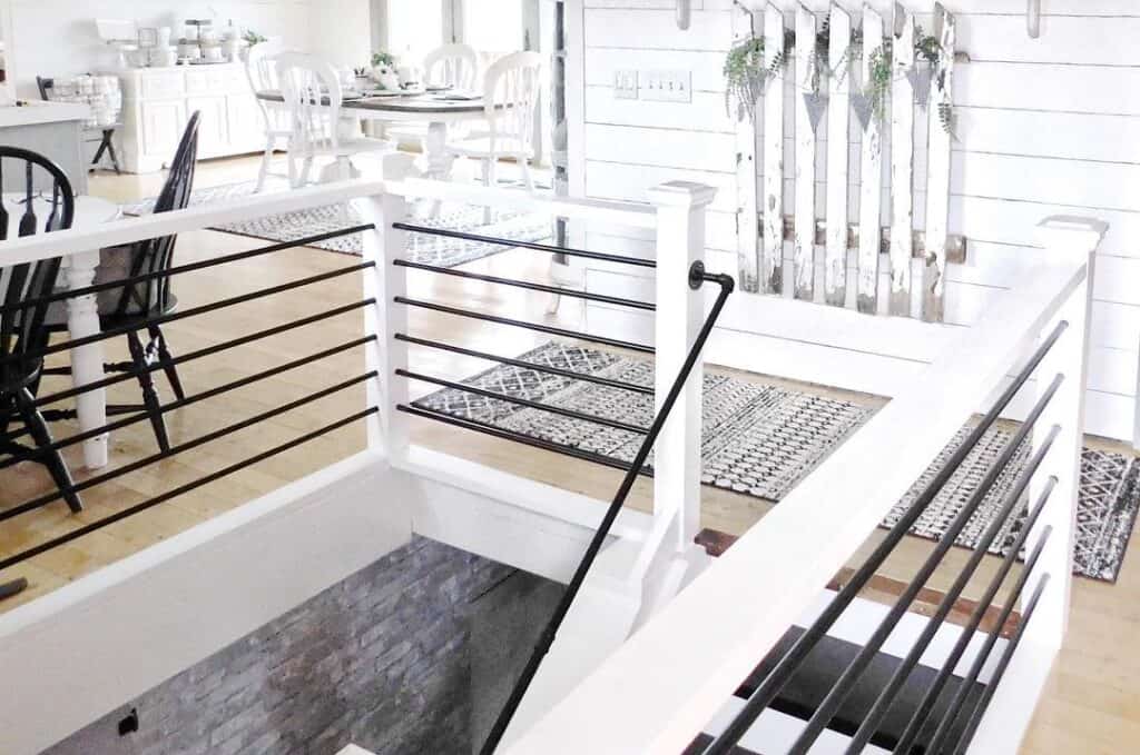 Black Metal Rails on White Staircase With Black Treads