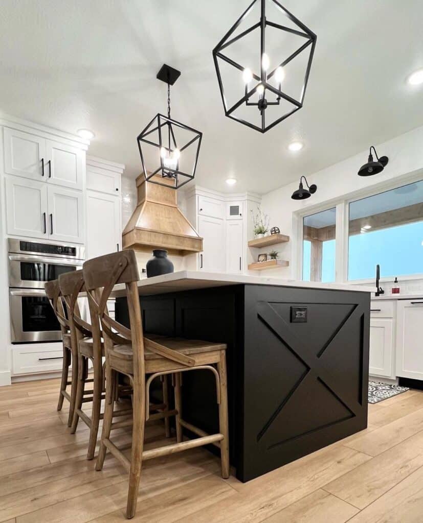 Black Pendant Lights Over Black and White Kitchen Island