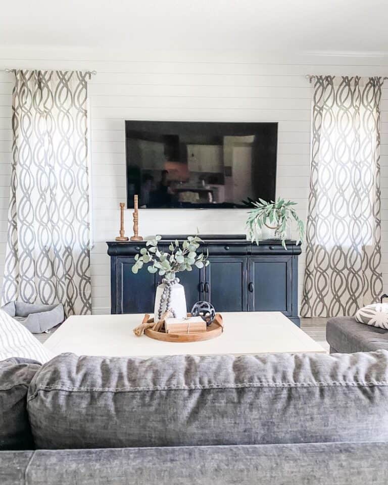 Black Sideboard Beneath Flat Screen TV