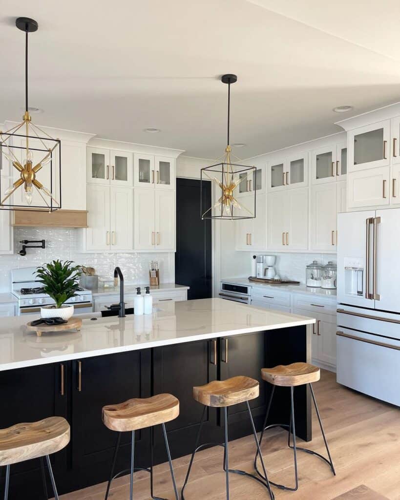 Black and Gold Pendant Lamps and White Cabinets with Gold Handles