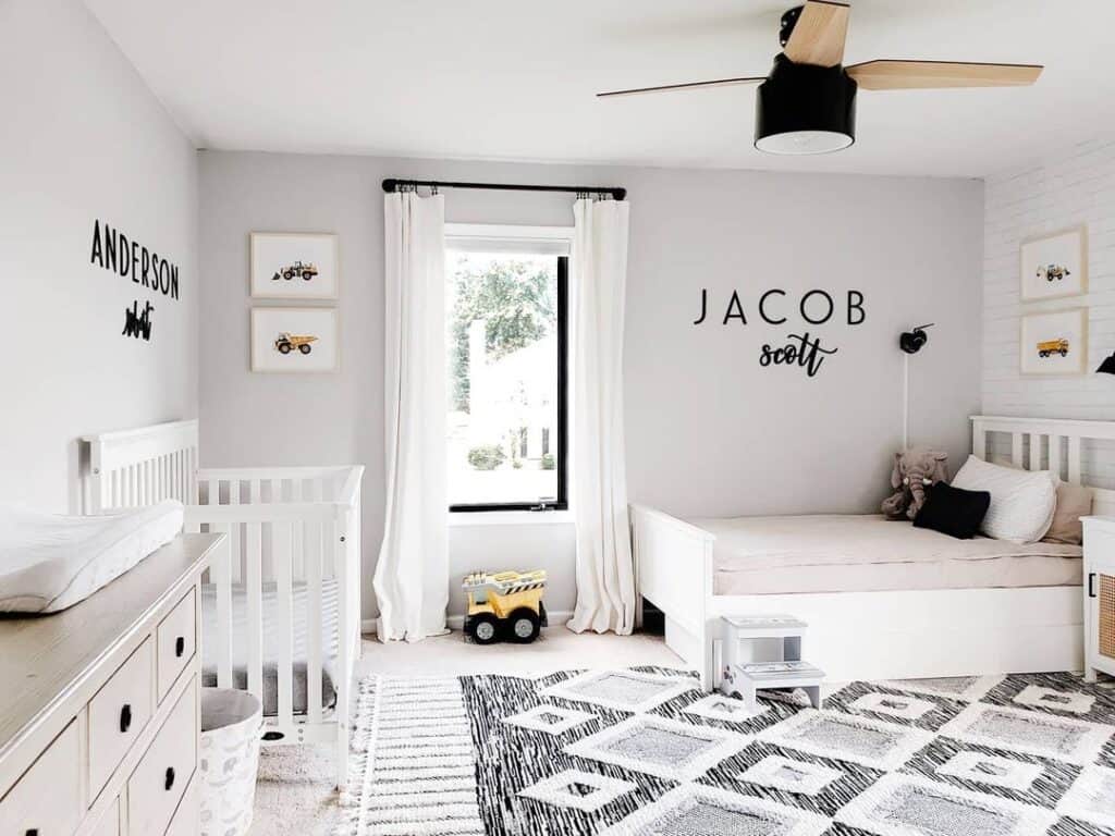 Black and White Boys' Room with Crib and Bed