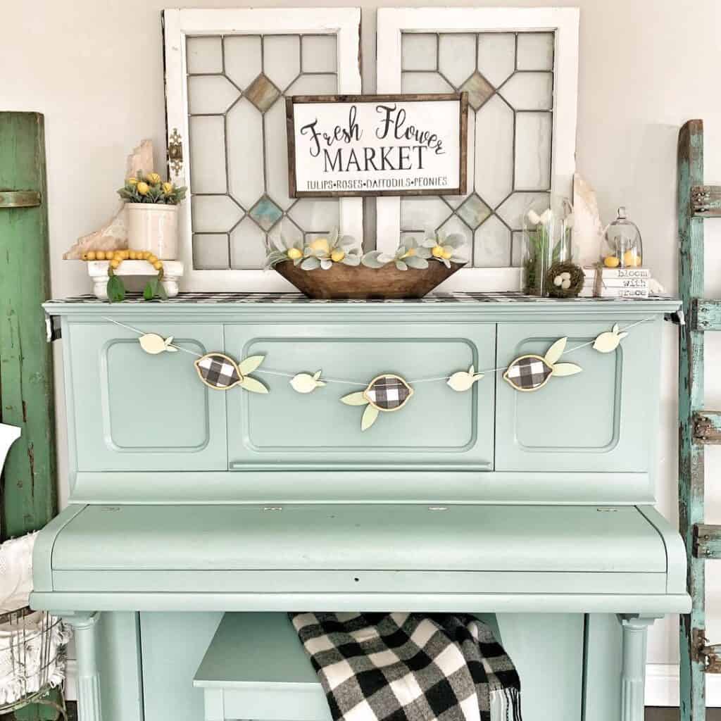 Blue and White Wall Decor and a Light Blue Piano