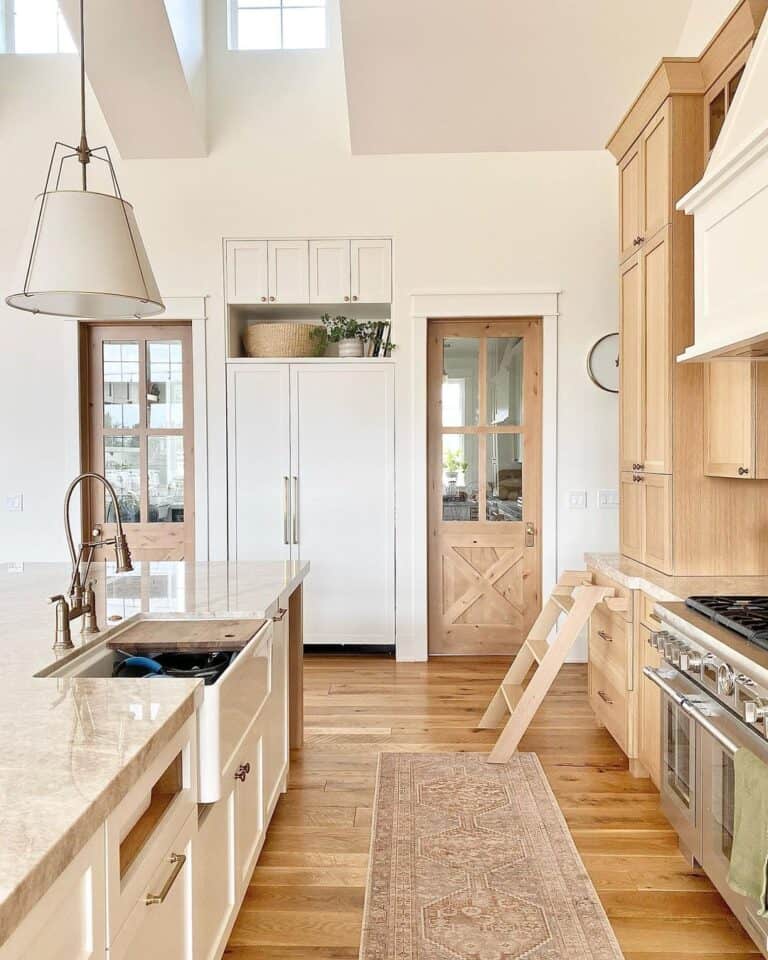 Brass Faucet With a Sprayer on a Brown Countertop