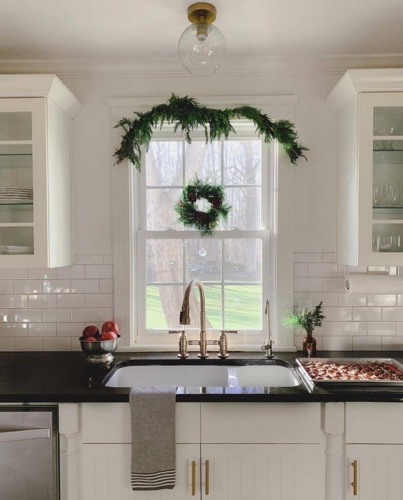 Brass Faucet on a Black Countertop