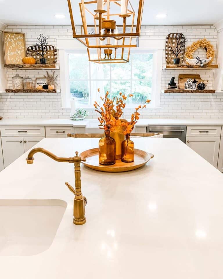 Brass Faucet on a White Kitchen Island