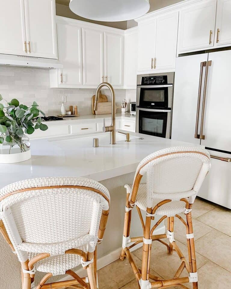 Brass Faucet on an Off-White Kitchen Island