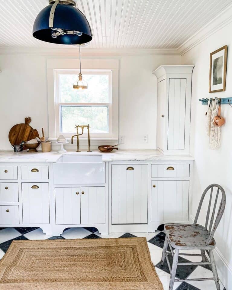 Bright Kitchen Window Illuminating Brass Faucet
