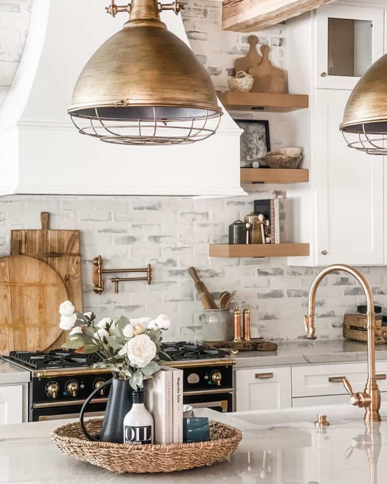 Bronze Pendant Lamps Over Brass Kitchen Faucet