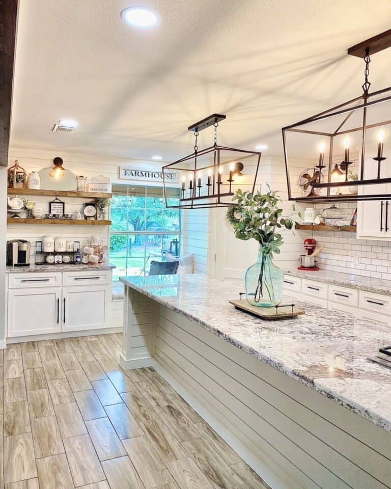 Bronze Pendant Lamps Over White Shiplap Kitchen Island