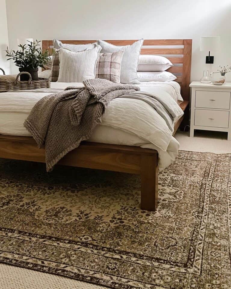 Brown Area Rug Laid Under a Wooden Bed