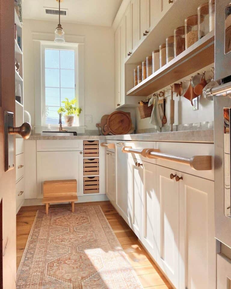 Butler's Pantry with White Cabinets and Brass Kitchen Knobs