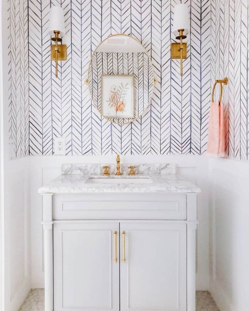 Chevron Wall Paint and Brass Sconce Bathroom