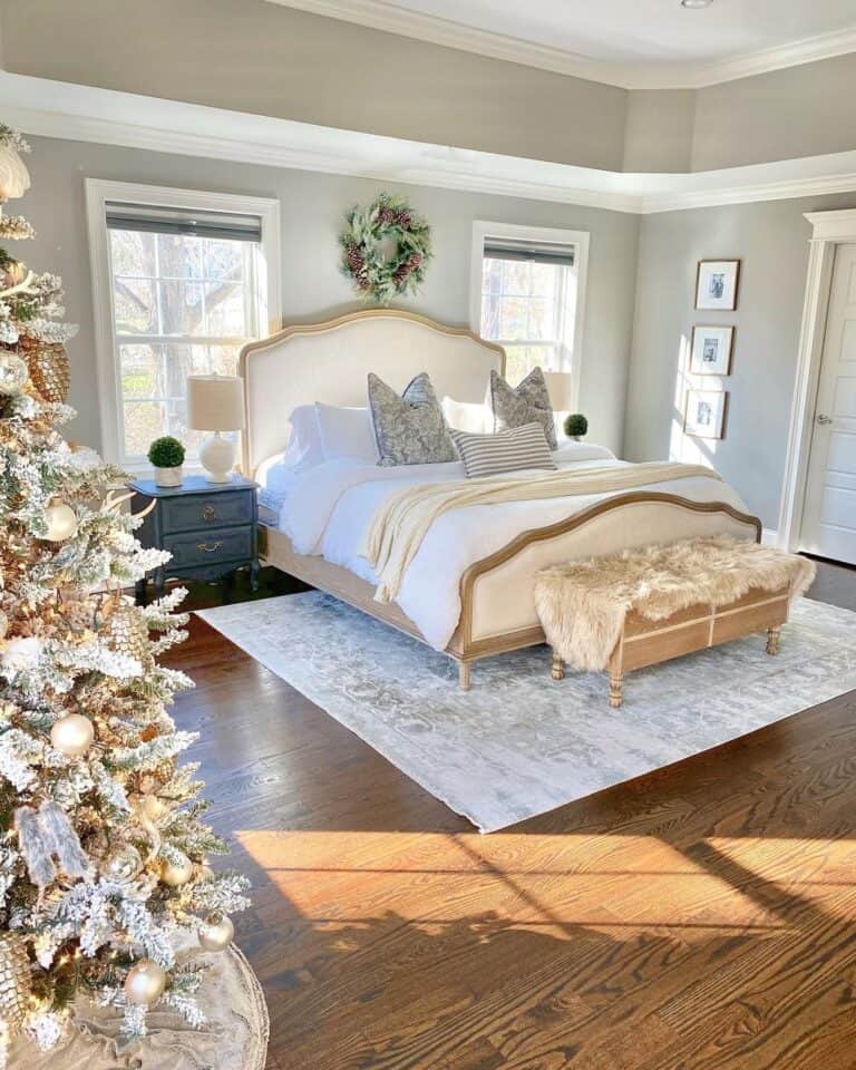 Christmas Tree and a White Rug Under a Bed