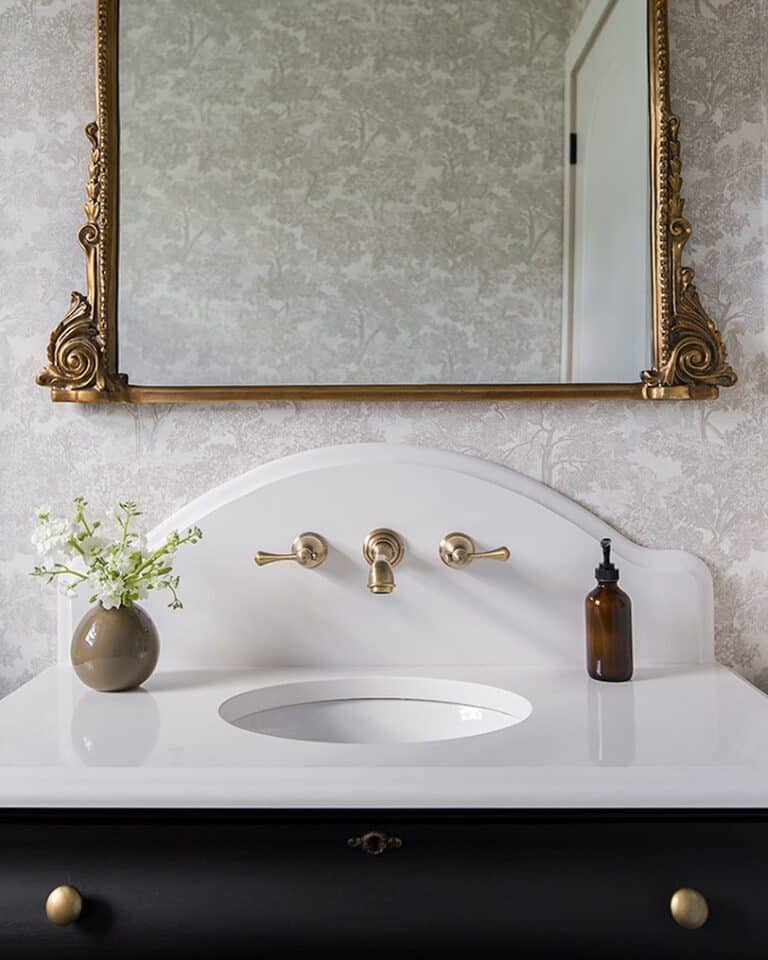 Curved Stone Vanity and Embellished Mirror