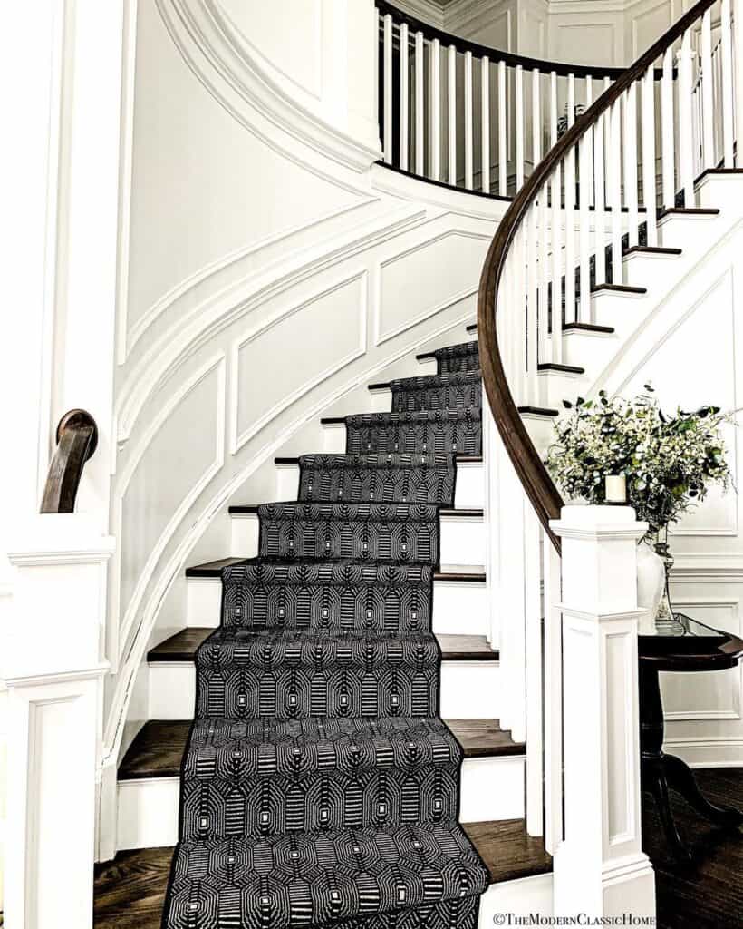 Curved White Staircase with Black Runner