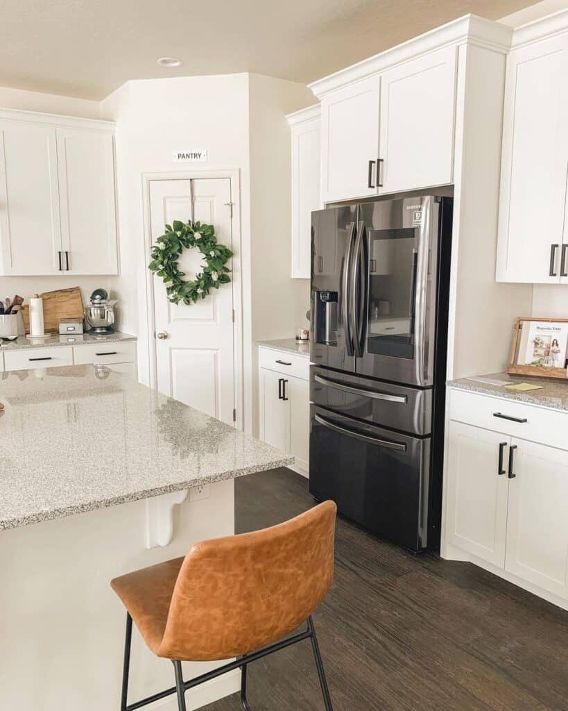 Dark Gray Fridge Under White Kitchen Cabinets