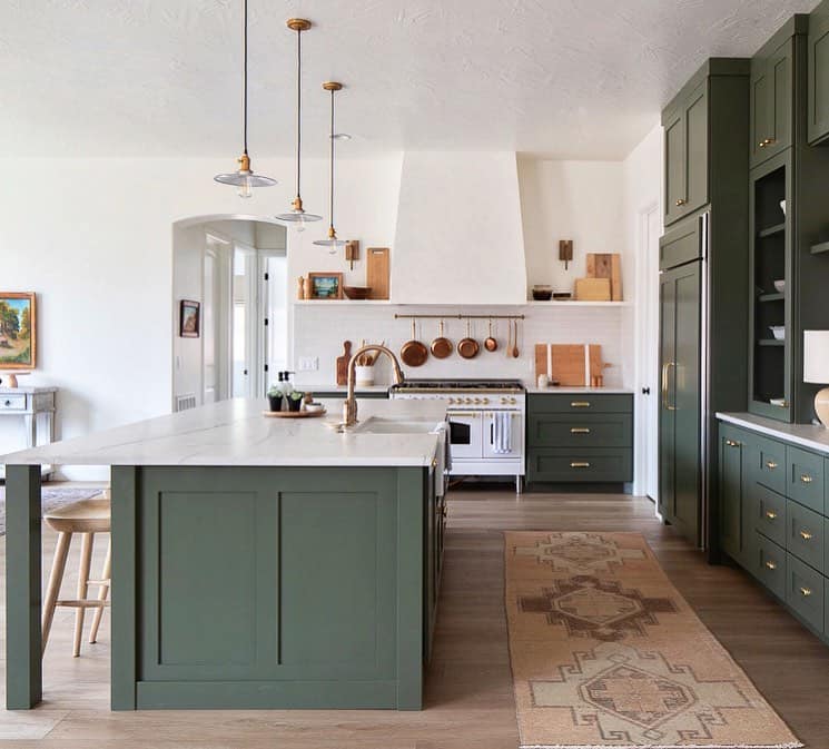 Dark Green Cabinets in White Range Kitchen