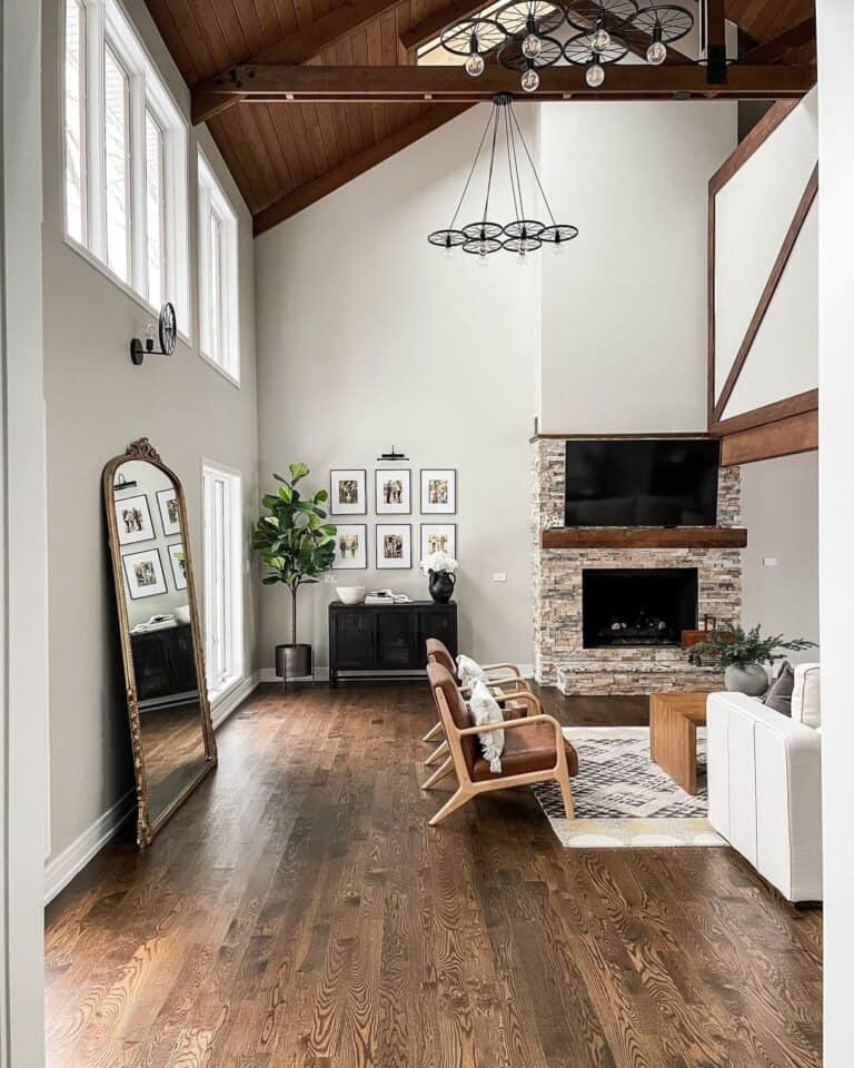 Dark Wood Vaulted Ceiling with Bicycle Wheel Light Fixtures