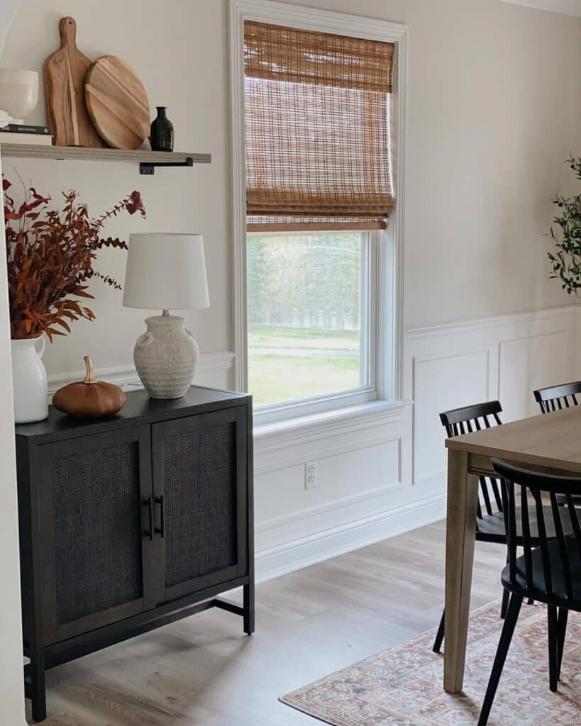 Dining Room with Black Buffet Under Shelf