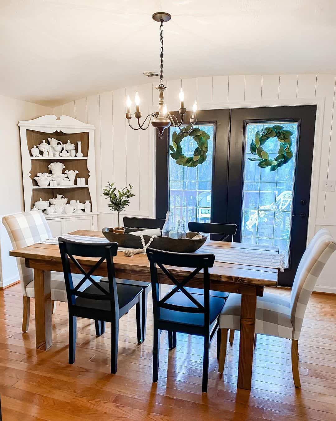 Dining room with white vertical shiplap wall soul lane
