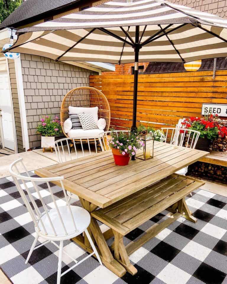 Egg Chair Patio with Striped Umbrella
