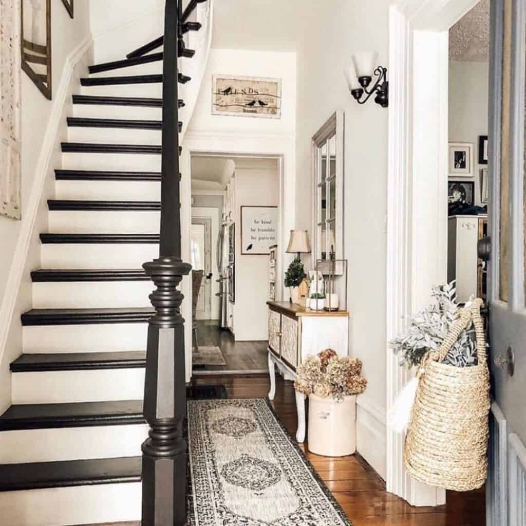 Entryway With Black and White Staircase