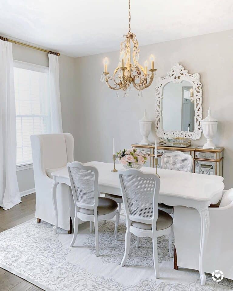 Gold Chandelier Over White Dining Table
