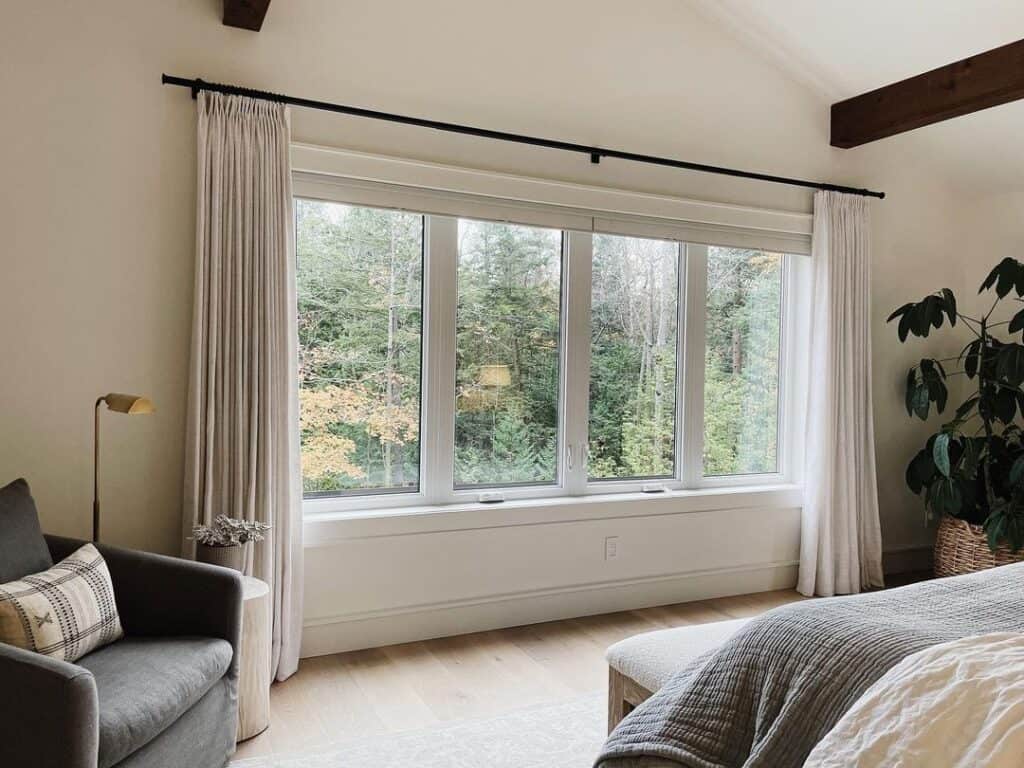 Gray Bedroom with Large Window and Curtain Panels - Soul & Lane