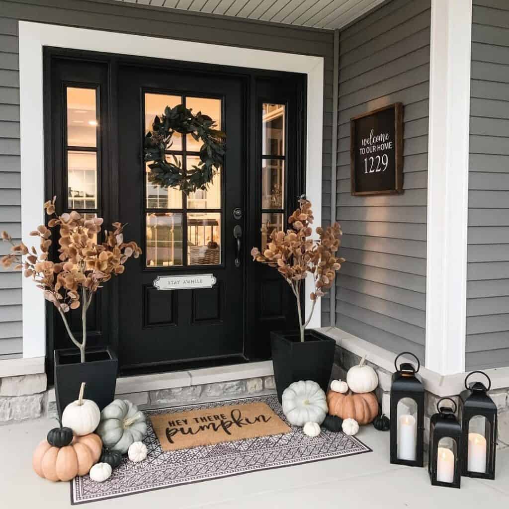 Gray Home With Black Front Door and Matching Sidelights