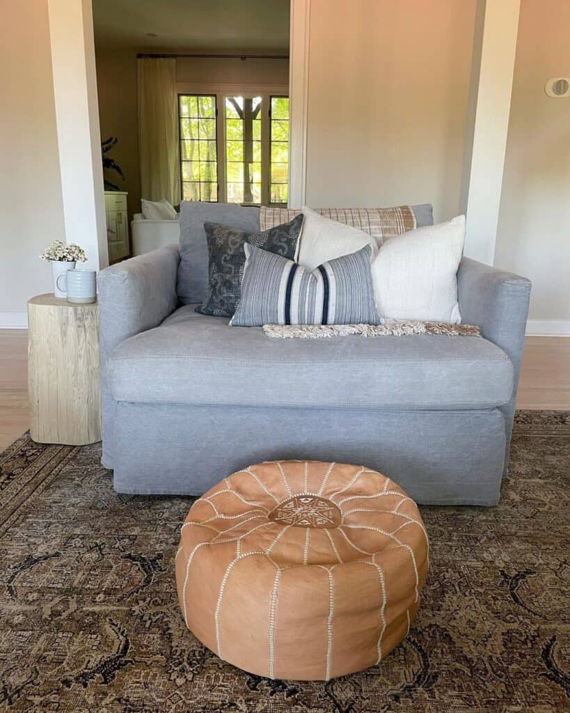 Gray Sofa and Leather Pouf
