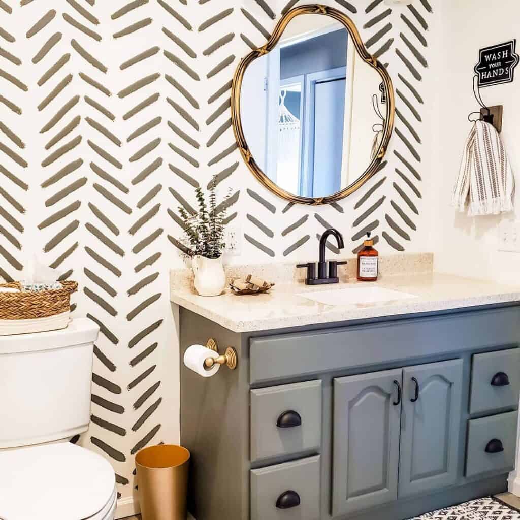 Gray Vanity and Hand Painted Wall