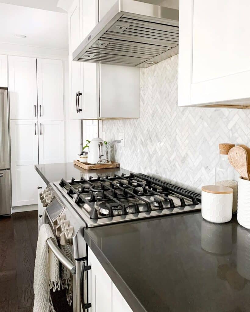 Gray and White Herringbone Backsplash Tile