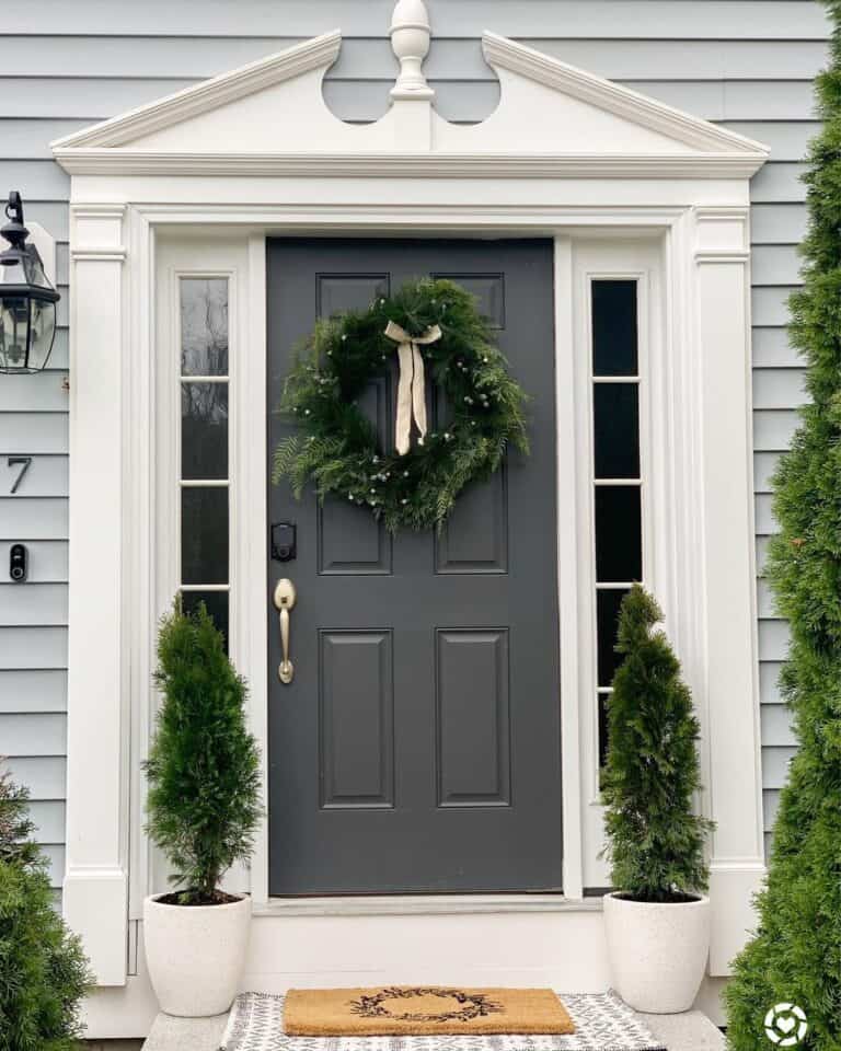 Green Wreath on a Dark Grey 6-Panel Front Door
