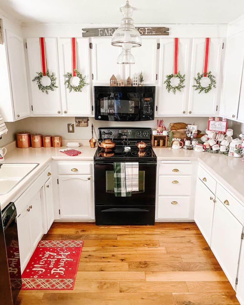 Green Wreaths Hanging in a U Shaped Kitchen