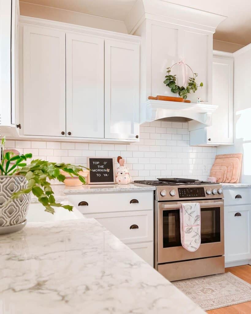 Greenery in White Tile Backsplash Kitchen