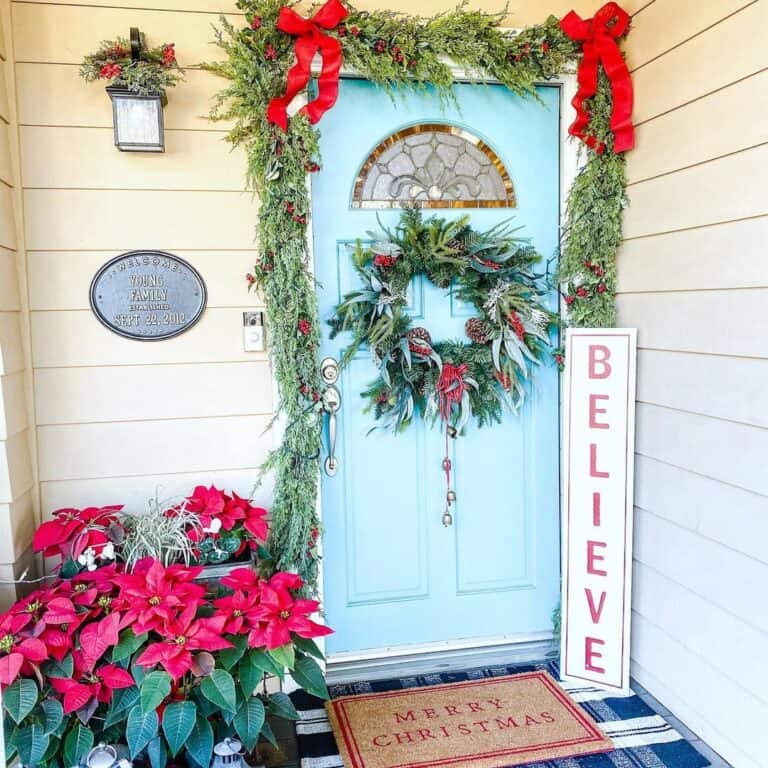Greens and Poinsettias as Front Door Decor